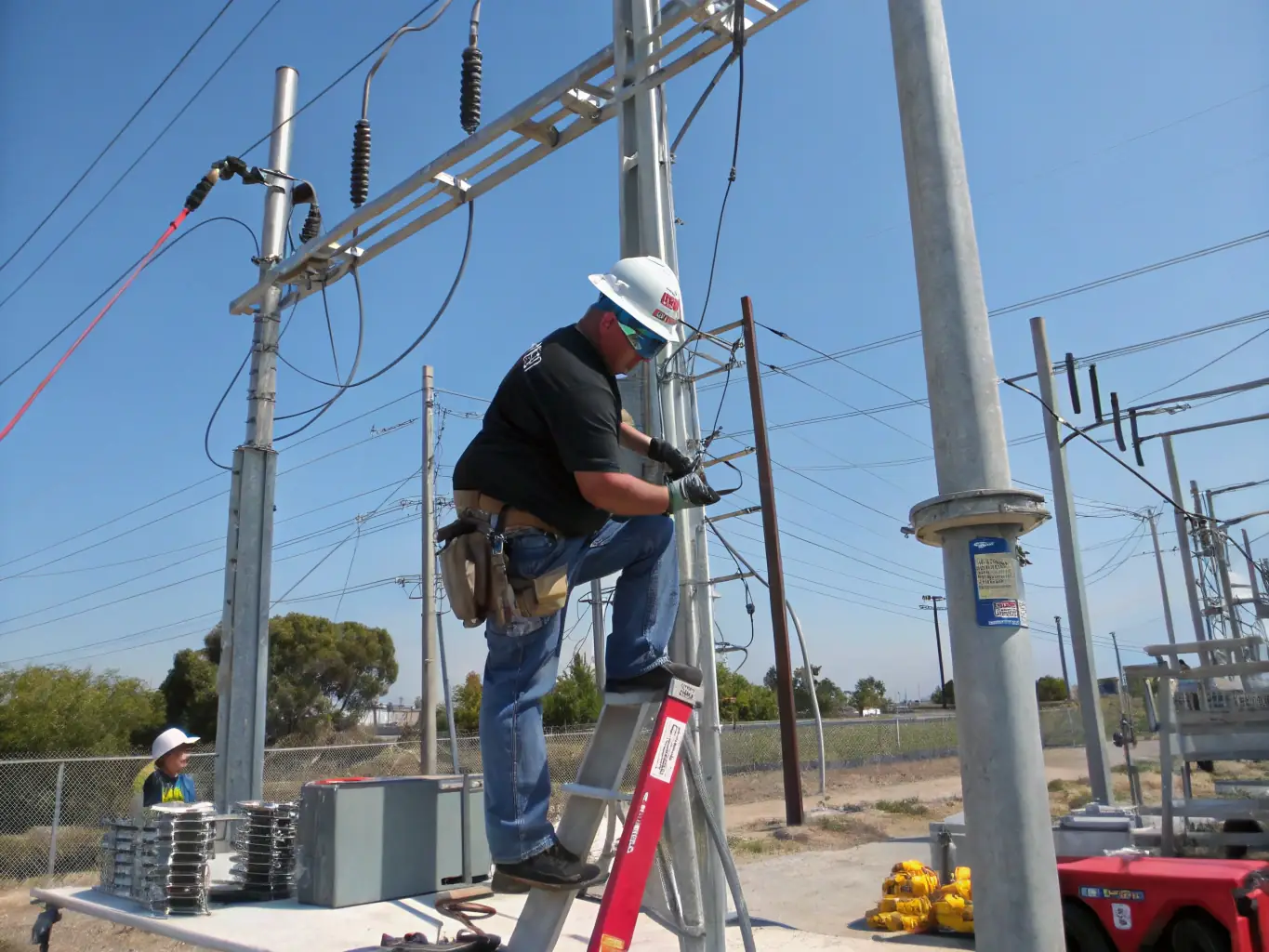 A distribution transformer being installed by MiPhi Engineering technicians, showcasing the precision and care taken during the installation process.